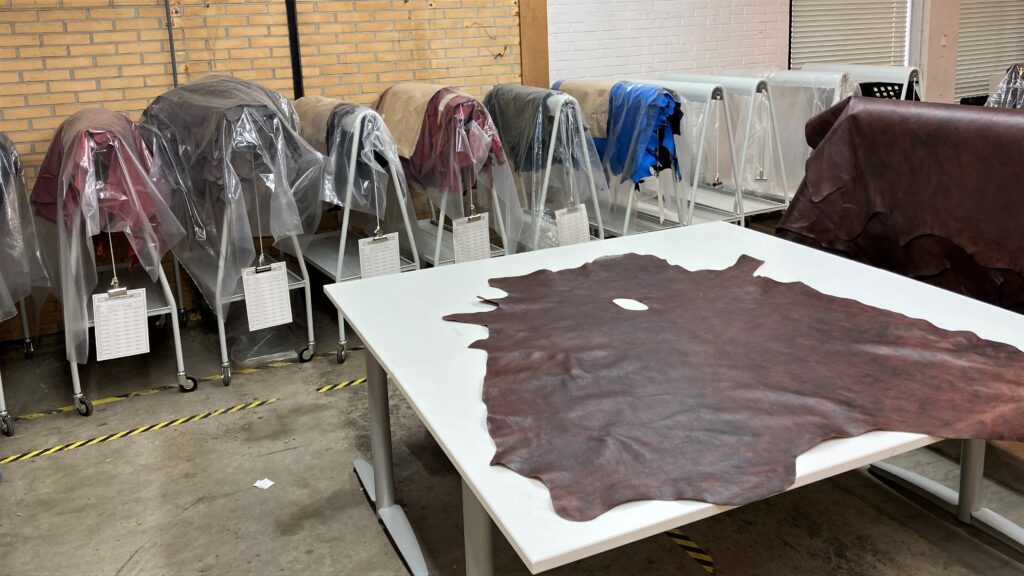 Various leathers being prepared for cutting